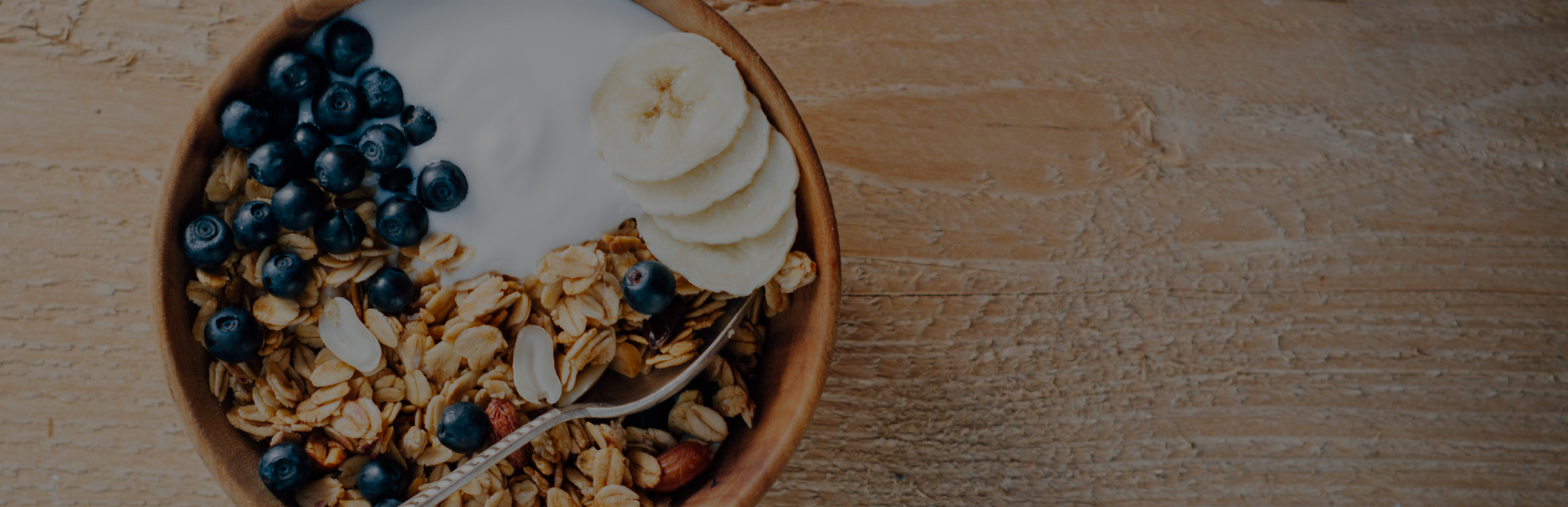 Healthy breakfast bowl with granola, yogurt, and fresh fruit